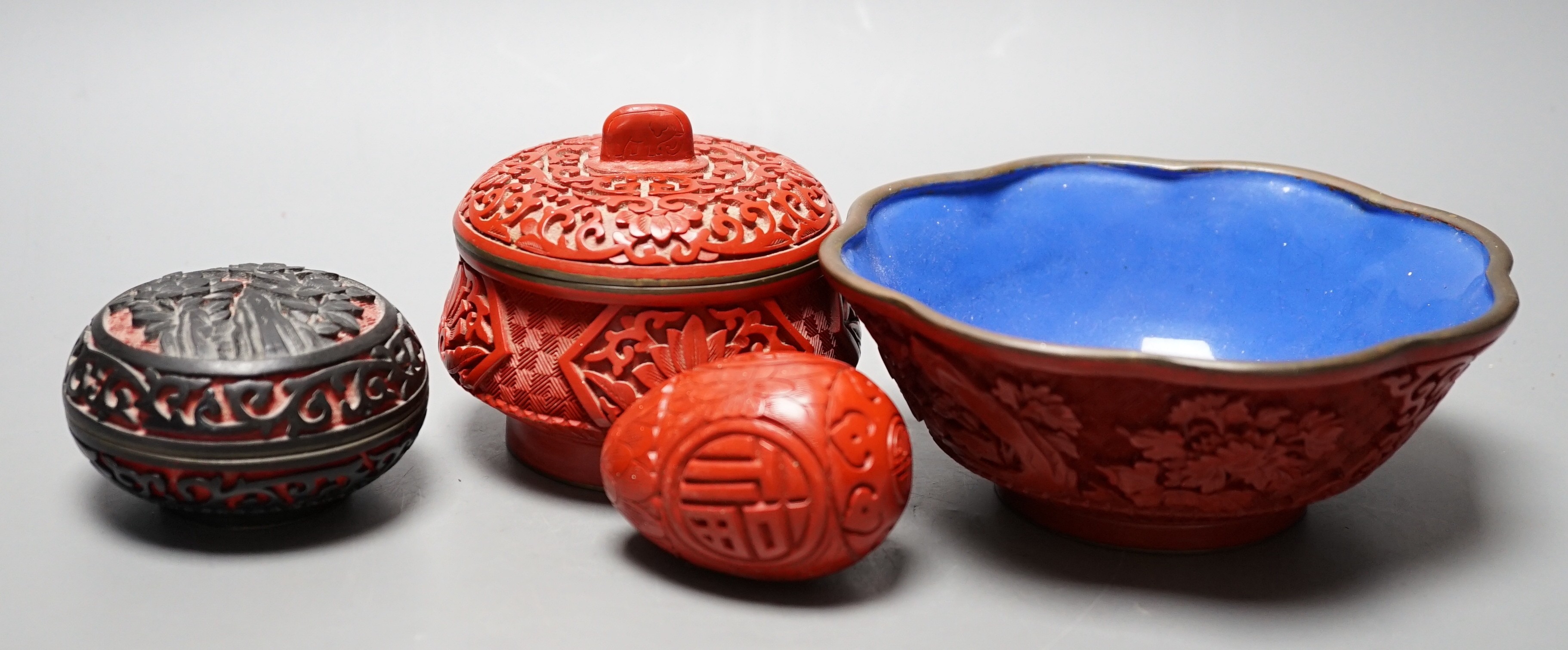 A Chinese cinnabar lacquer bowl, 15cm a similar covered box and egg, and a carved circular box and cover